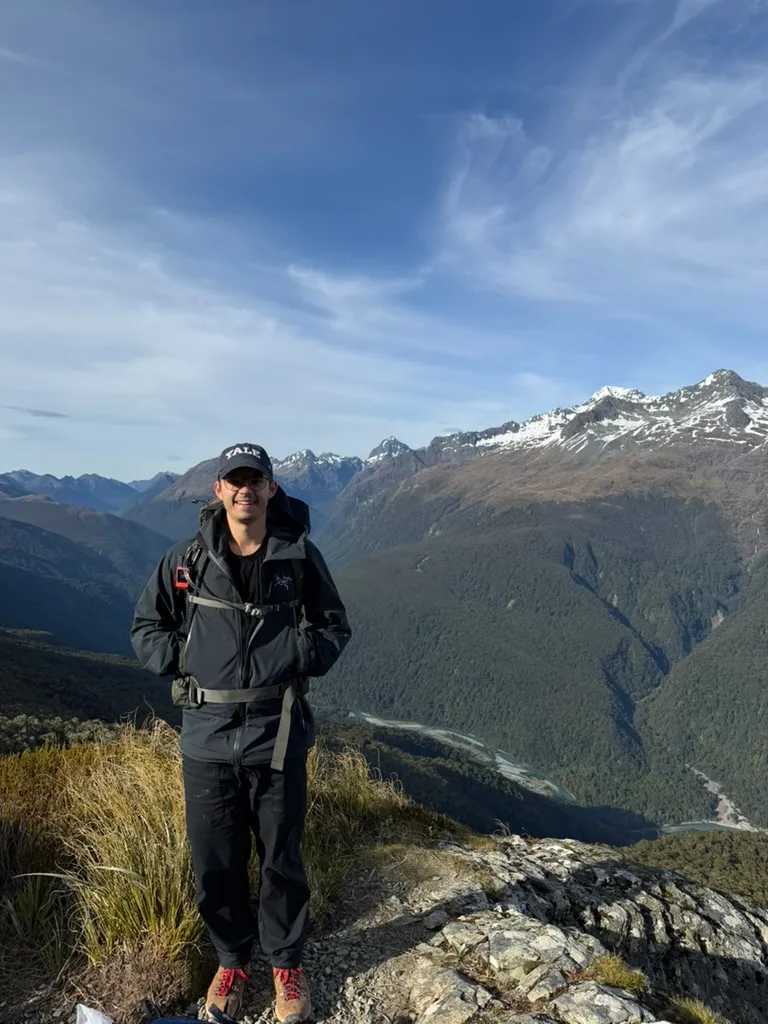 On a ridgeline above a river valley in the mountains